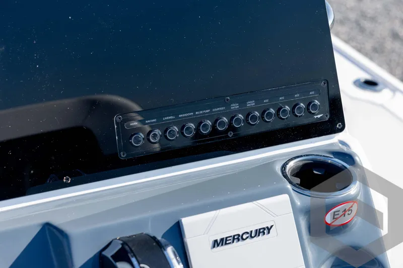 Slide: The Image of 2026 Tidewater 2110 Bay Max dashboard with Mercury controls and switch panel. - 53