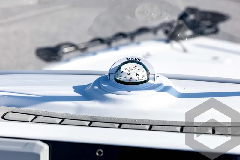 Slide: The Image of Compass on 2026 Tidewater 2110 Bay Max boat dashboard, close-up view. - 56