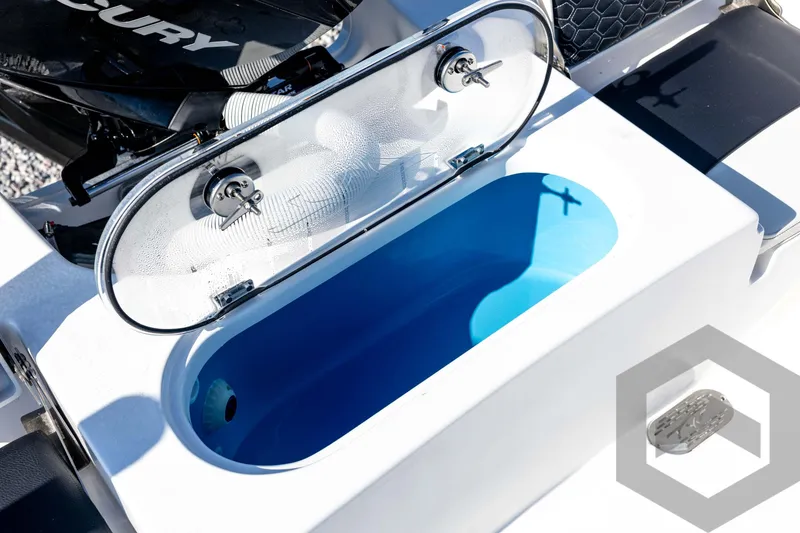 Slide: The Image of 2026 Tidewater 2110 Bay Max boat livewell with open lid and blue interior. - 66