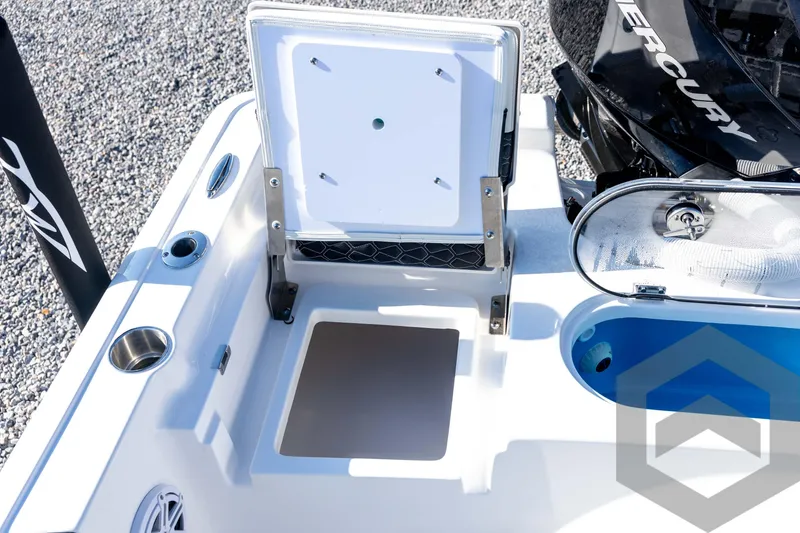 Slide: The Image of 2026 Tidewater 2110 Bay Max boat interior with storage compartment and Mercury engine. - 67