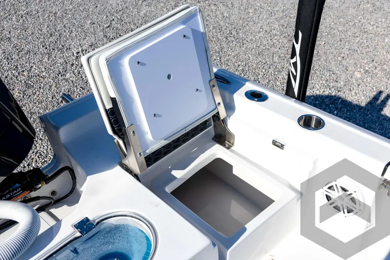 Slide: The Image of 2026 Tidewater 2110 Bay Max boat storage compartment with open lid, showcasing interior features. - 68