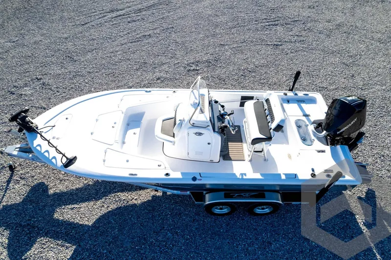 Slide: The Image of 2026 Tidewater 2110 Bay Max boat on trailer, aerial view, parked on gravel. - 74
