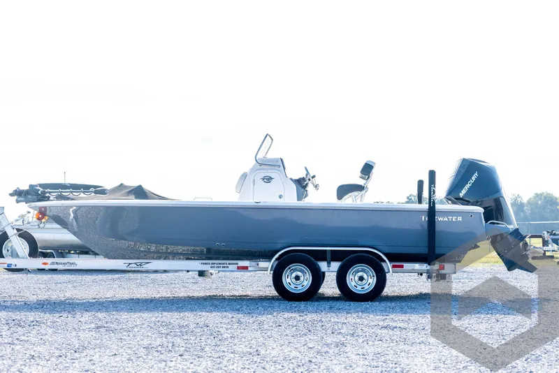 Slide: The Image of 2026 Tidewater 2110 Bay Max boat on trailer, side view, outdoors. - 8