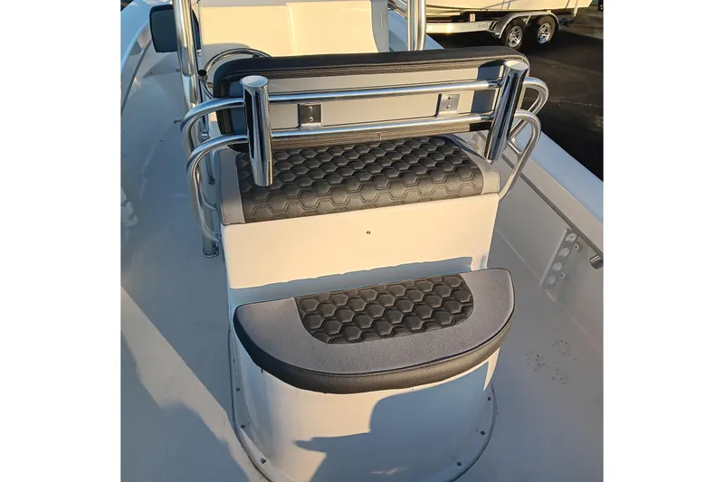 Slide: The Image of 2026 May-Craft 238 CC boat interior with cushioned seating and stainless steel rails. - 13