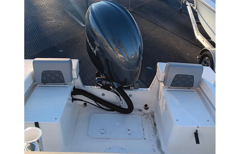 Slide: The Image of 2026 May-Craft 238 CC boat with Yamaha outboard engine, rear seating, and storage compartments. - 15