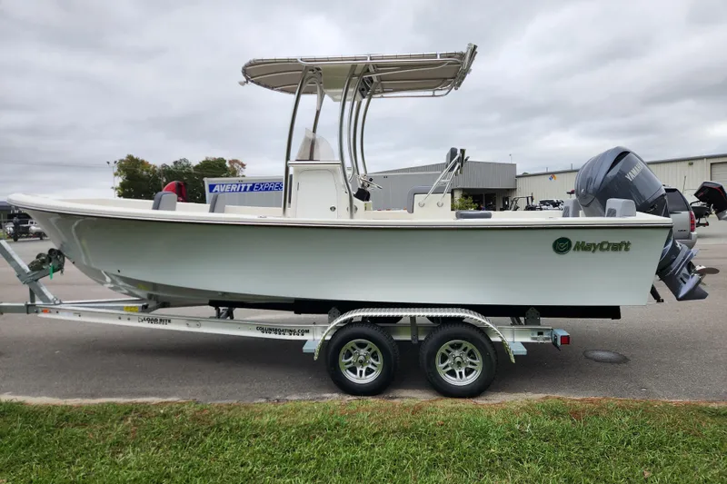 Slide: The Image of 2026 May-Craft 238 CC boat on trailer, parked outdoors, side view. - 5