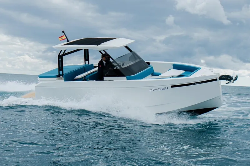 Slide: The Image of 2026 De Antonio Yachts D29 cruising on open water under cloudy skies. - 0