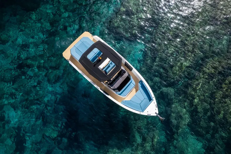 Slide: The Image of Aerial view of 2026 De Antonio Yachts D29 on clear turquoise water. - 13