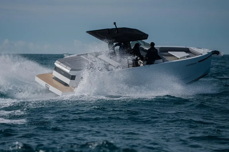 Slide: The Image of 2026 De Antonio Yachts D29 cruising on open water, showcasing sleek design and performance. - 3