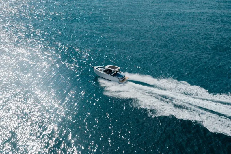 Slide: The Image of 2026 De Antonio Yachts D29 cruising on sparkling blue ocean waters. - 7