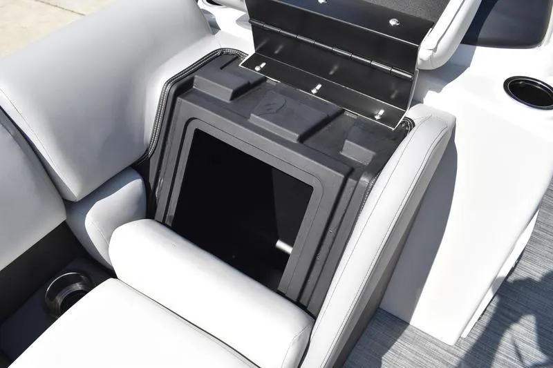 Slide: The Image of 2023 Lowe SS 230 DV boat storage compartment with open lid, showcasing interior space. - 12