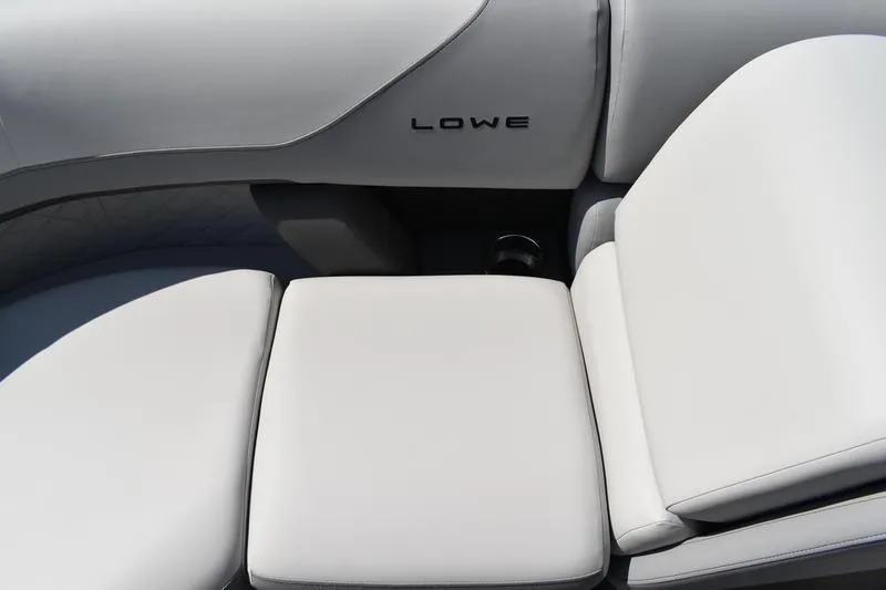 Slide: The Image of 2023 Lowe SS 230 DV boat interior with white cushioned seating. - 13