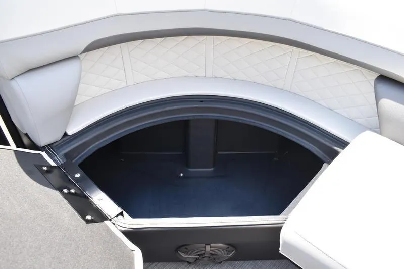 Slide: The Image of 2023 Lowe SS 230 DV boat interior storage compartment with cushioned seating. - 16