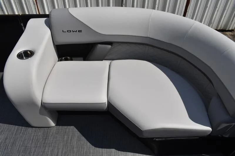 Slide: The Image of 2023 Lowe SS 230 DV boat interior with sleek white seating and cup holder. - 20