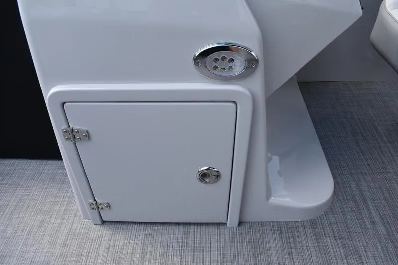 Slide: The Image of 2023 Lowe SS 230 DV boat storage compartment with sleek design and metallic accents. - 26