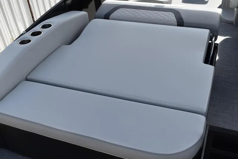 Slide: The Image of 2023 Lowe SS 230 DV boat interior with cushioned seating and cup holders. - 37