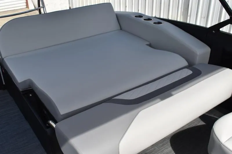 Slide: The Image of 2023 Lowe SS 230 DV boat interior with gray cushioned seating and cup holders. - 40