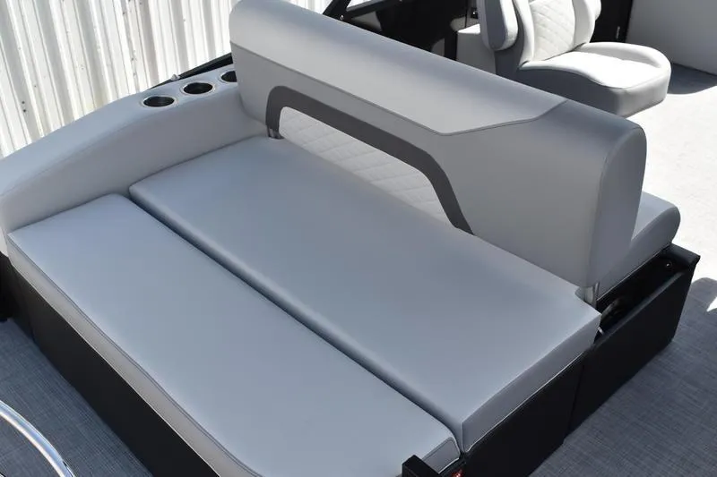 Slide: The Image of 2023 Lowe SS 230 DV boat interior with gray seating and cup holders. - 41