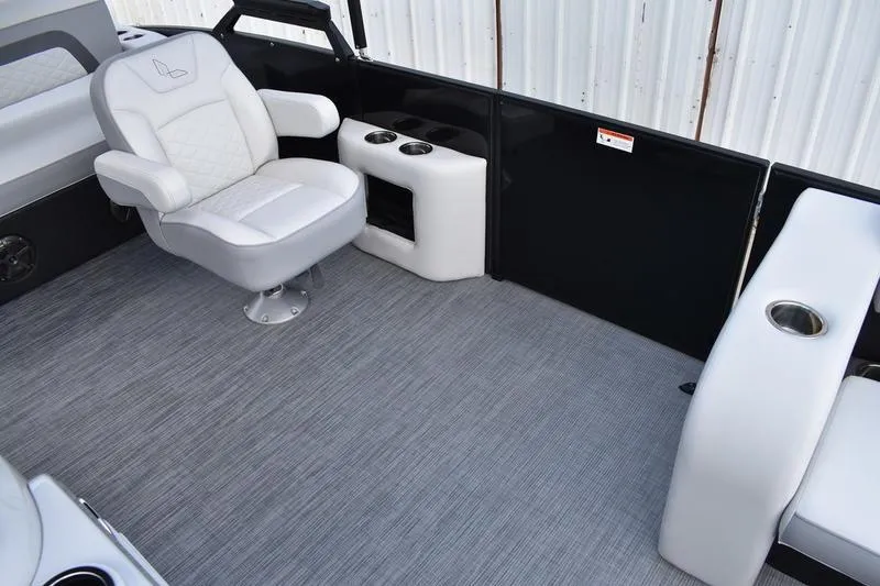 Slide: The Image of 2023 Lowe SS 230 DV boat interior with plush seating and cup holders. - 21