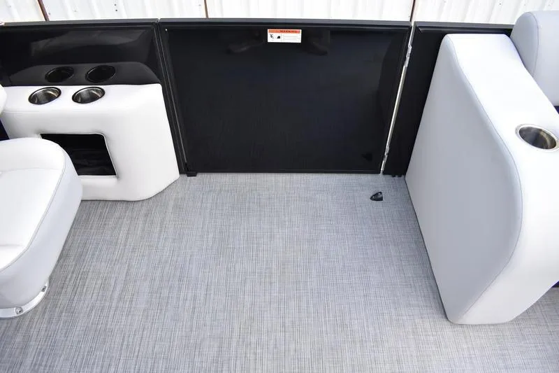 Slide: The Image of 2023 Lowe SS 230 DV boat interior with cup holders and seating. - 22