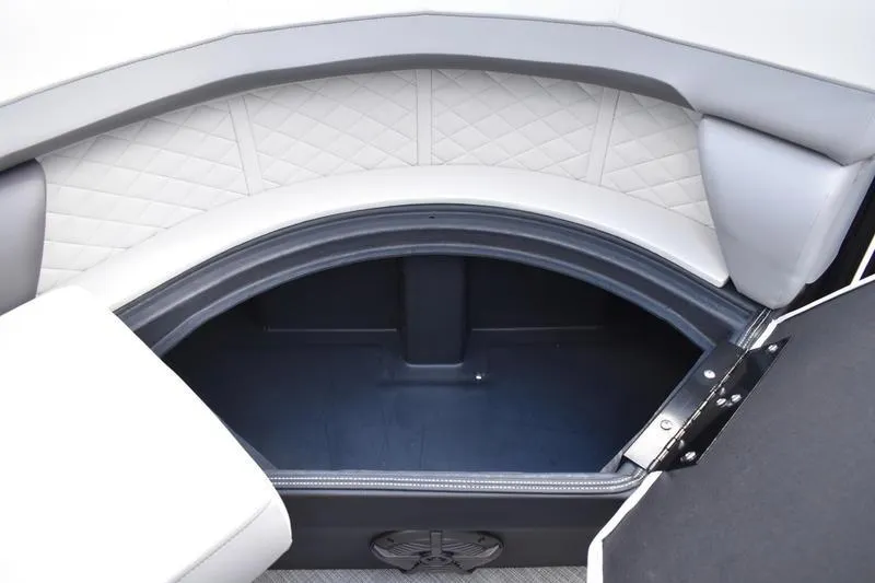 Slide: The Image of 2023 Lowe SS 230 DV boat storage compartment with cushioned seating and quilted design. - 23