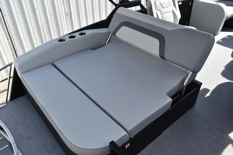 Slide: The Image of 2023 Lowe SS 230 DV boat with gray cushioned seating and cup holders. - 36
