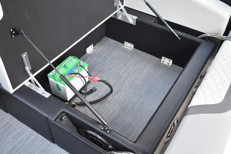 Slide: The Image of 2023 Lowe SS 230 DV boat storage compartment with battery and wiring. - 39