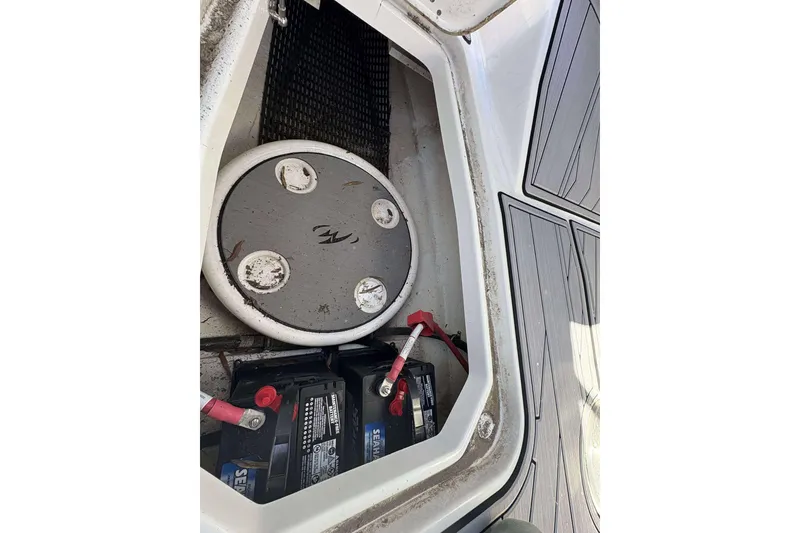 Slide: The Image of Battery compartment of 2023 Monterey 238SS Super Sport boat, showing wiring and components. - 12
