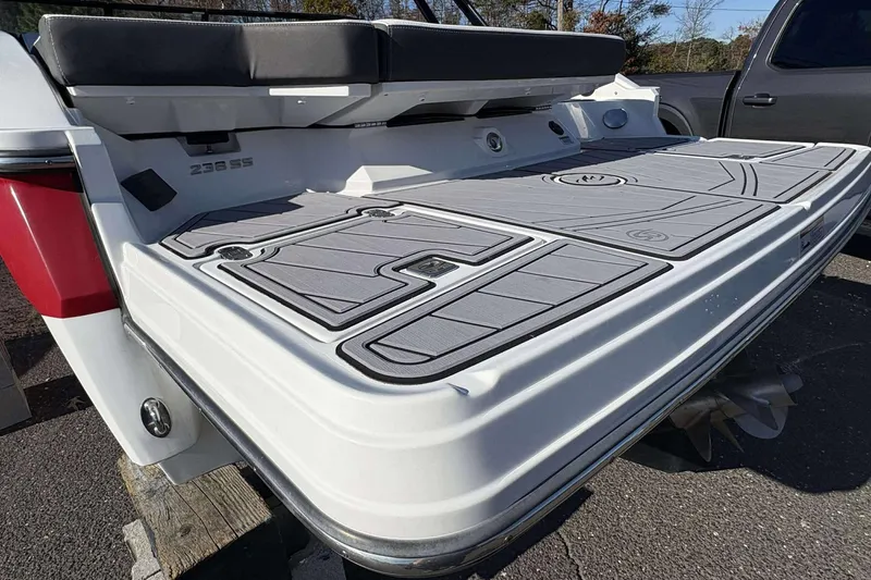 Slide: The Image of 2023 Monterey 238SS Super Sport boat with sleek deck design and cushioned seating. - 25