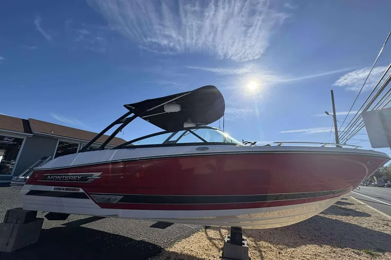 Slide: The Image of 2023 Monterey 238SS Super Sport boat displayed outdoors under a sunny sky. - 3