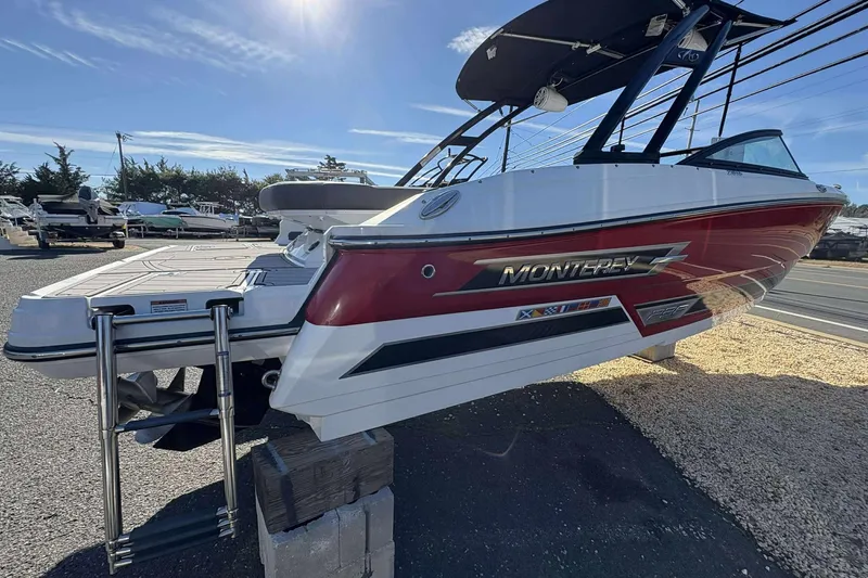 Slide: The Image of 2023 Monterey 238SS Super Sport boat displayed outdoors on a sunny day. - 4