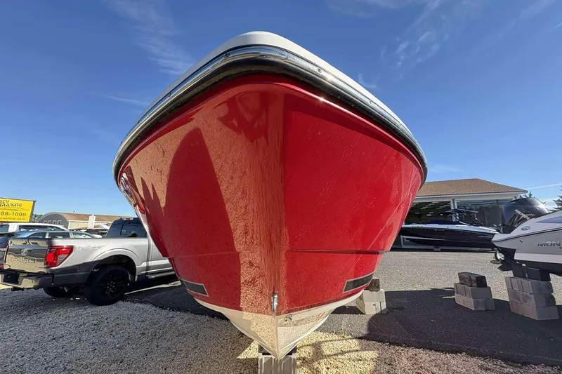 Slide: The Image of 2023 Monterey 238SS Super Sport boat in vibrant red, displayed outdoors. - 5