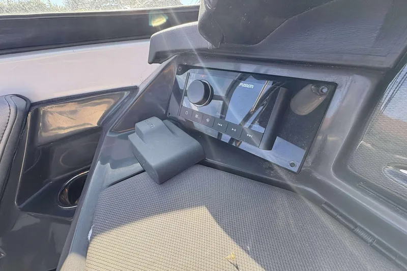 Slide: The Image of 2023 Monterey 238SS Super Sport boat dashboard with Fusion audio system. - 8