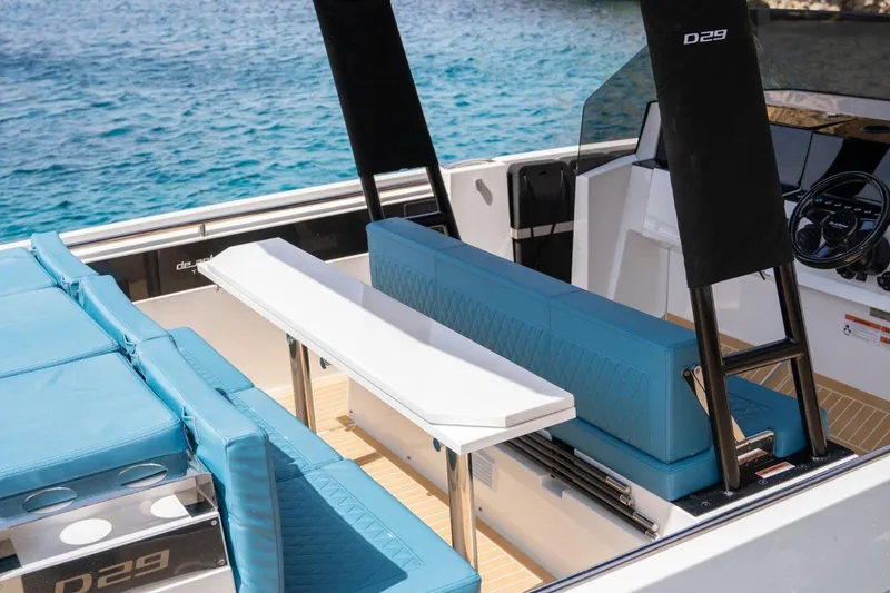 Slide: The Image of Luxurious 2026 De Antonio Yachts D29 interior with blue seating and sleek design. - 19