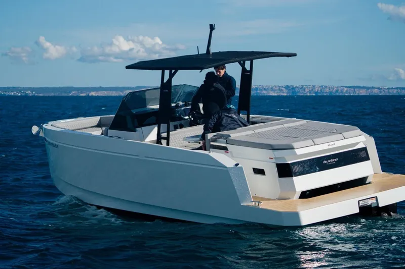 Slide: The Image of 2026 De Antonio Yachts D29 cruising on open water under clear skies. - 2