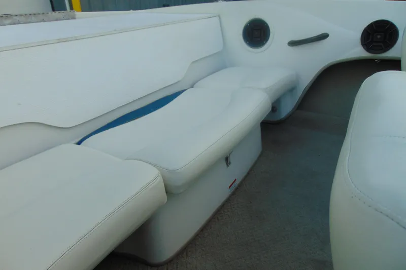 Slide: The Image of 2007 Tahoe Q4 I/O Sport boat interior with white seating and speakers. - 13