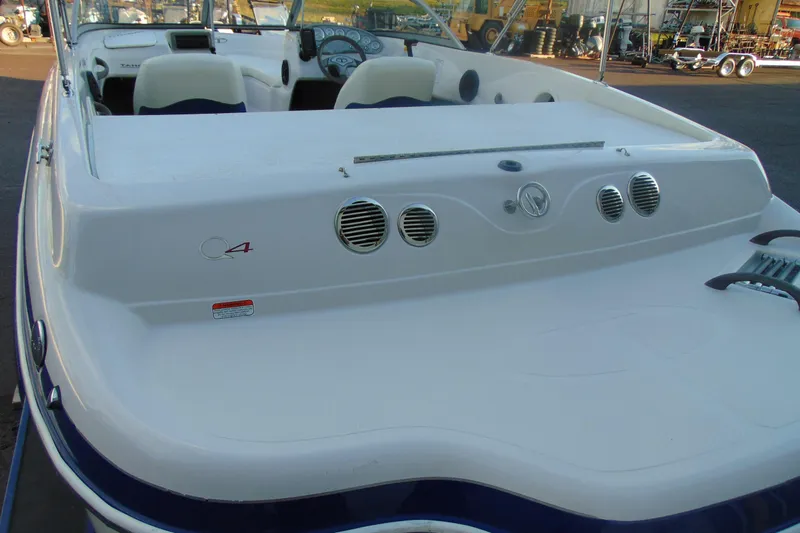 Slide: The Image of 2007 Tahoe Q4 I/O Sport boat, rear view, white exterior, docked in marina. - 5
