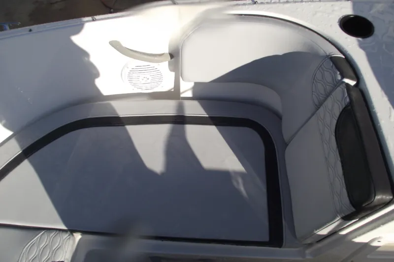 Slide: The Image of Interior seating of 2026 Bayliner M19 boat, featuring modern design and speaker system. - 10