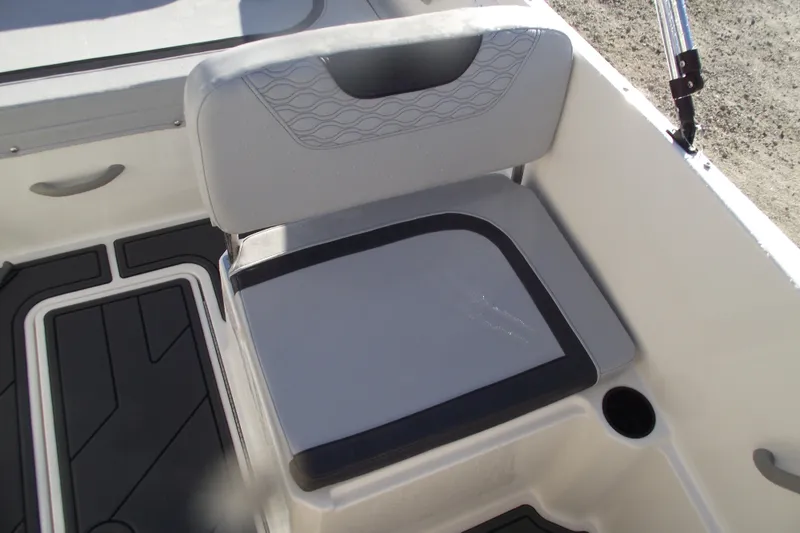 Slide: The Image of Bayliner M19 2026 boat seat with modern design and cup holder. - 21