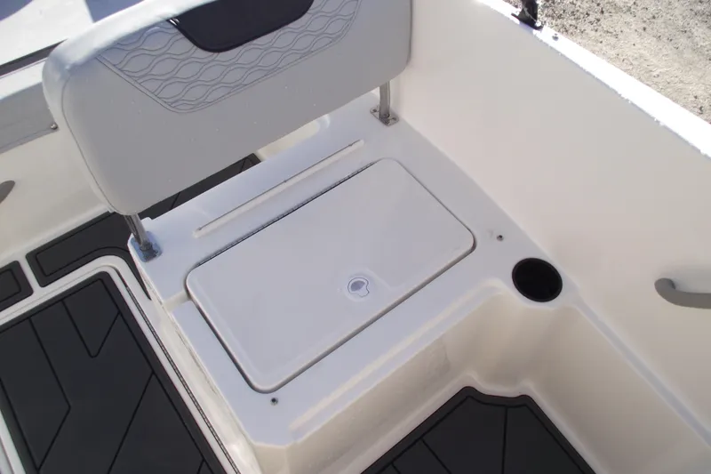 Slide: The Image of 2026 Bayliner M19 boat interior with storage compartment and seating. - 22