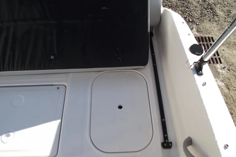 Slide: The Image of Bayliner M19 2026 boat interior, featuring storage compartments and seating area. - 29