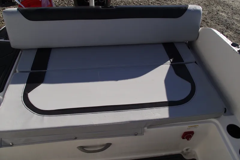 Slide: The Image of 2026 Bayliner M19 boat interior seating with gray and black upholstery. - 32