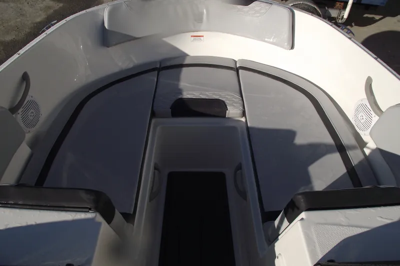 Slide: The Image of 2026 Bayliner M19 boat interior with cushioned seating and modern design. - 5