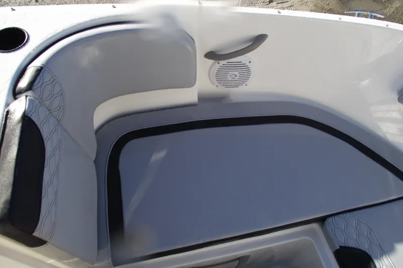 Slide: The Image of 2026 Bayliner M19 boat interior with cushioned seating and speaker. - 6