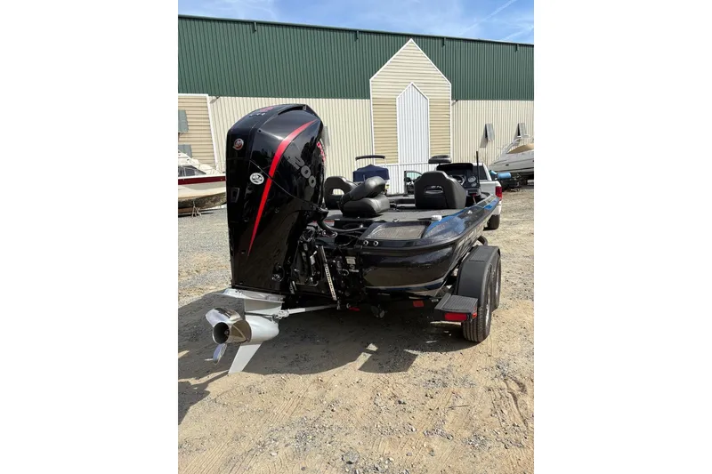 Slide: The Image of 2024 Nitro Z19 boat with powerful outboard motor, parked outdoors. - 3