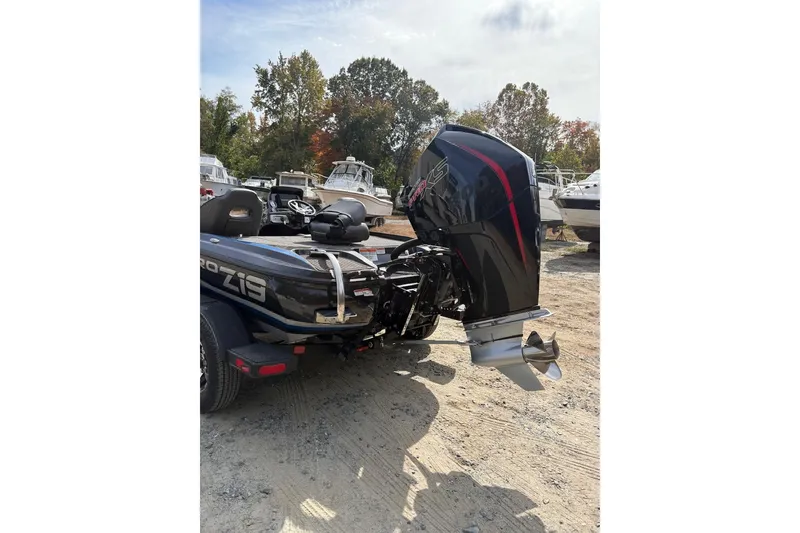 Slide: The Image of 2024 Nitro Z19 boat with powerful outboard motor in a boatyard setting. - 5