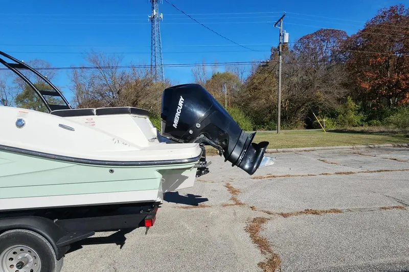Slide: The Image of 2021 Sea Ray SPX 230 Outboard boat with Mercury engine on a trailer. - 23