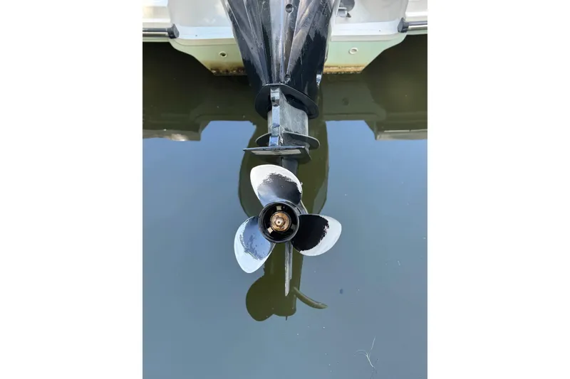 Slide: The Image of Propeller of 2021 Sea Ray SPX 230 Outboard boat in water, close-up view. - 26