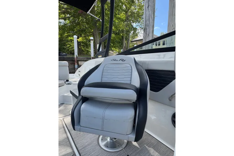 Slide: The Image of 2021 Sea Ray SPX 230 Outboard boat seat, luxurious design, outdoor setting. - 7