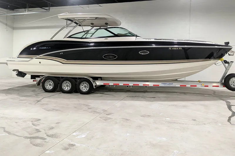 The Image of 2014 Formula 350 Crossover Bowrider on trailer in indoor storage. - 0